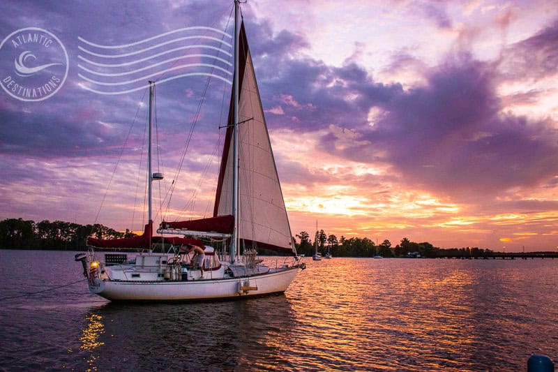 sunset and sunrise photos on vacation - part of a larger picture with a sailboat