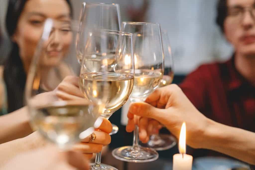 group wine tour - clinking glasses