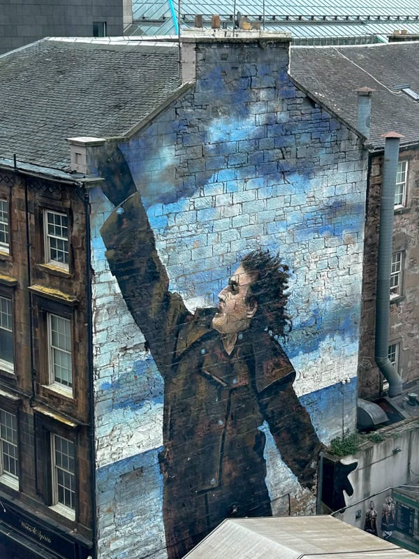 On the Glasgow Mural Trail, a three-story portrait on tenement building of one of Glasgow's favorite sons, Billy Connolly.
